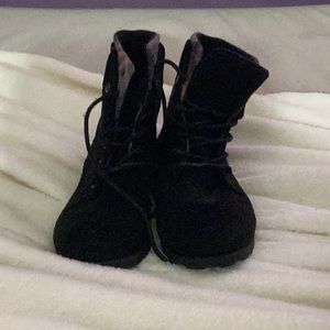 This is a black purple blue long lace boot.